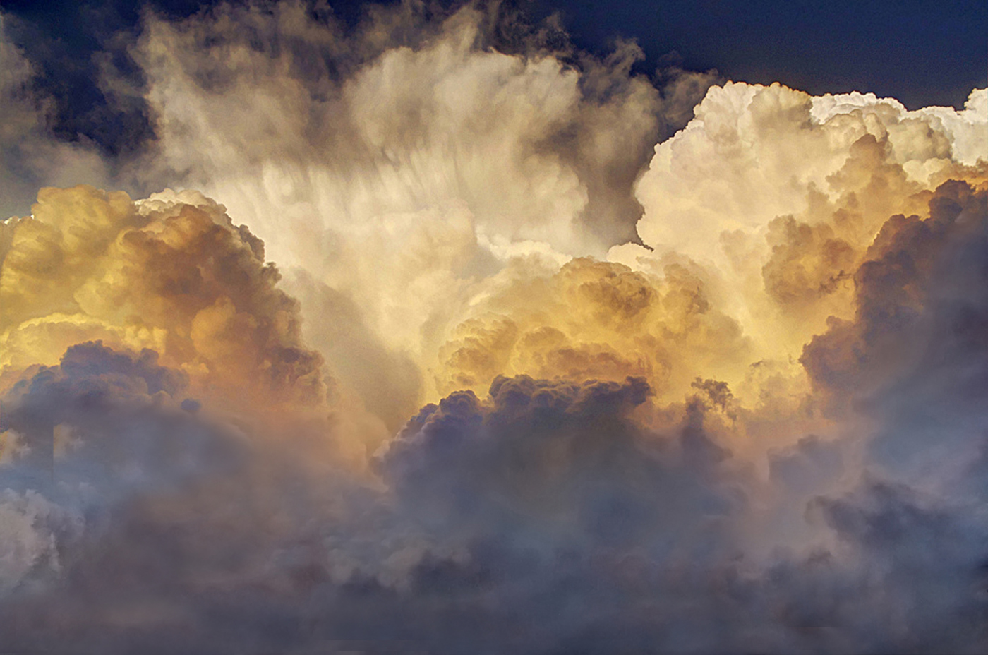 3 updrafts from a severe storm back lit by the setting sun in Kansas. May 2012 3 updrafts from a severe storm back lit by the setting sun in Kansas. May 2012